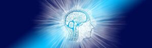 Radiating blue light emerging from a silhouette of a human head with a visible brain and neural pathways, symbolizing expanded consciousness, neuroplasticity, and mental clarity.