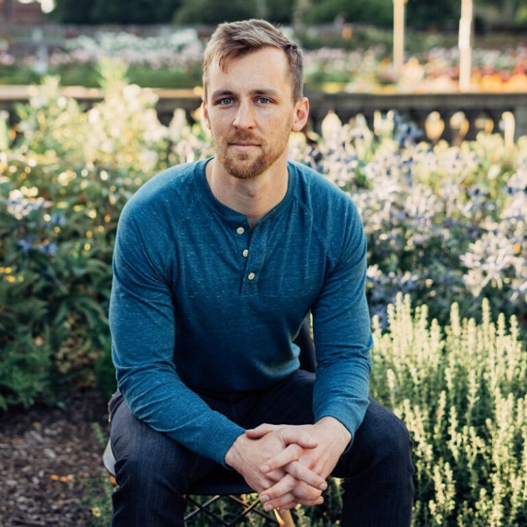 "Matthew Hicks, psilocybin researcher and author of the recent study, seated outdoors in a garden setting"