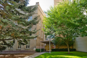 Neutral exterior of a university research building associated with ethical psilocybin research and voluntary data collection in Oregon