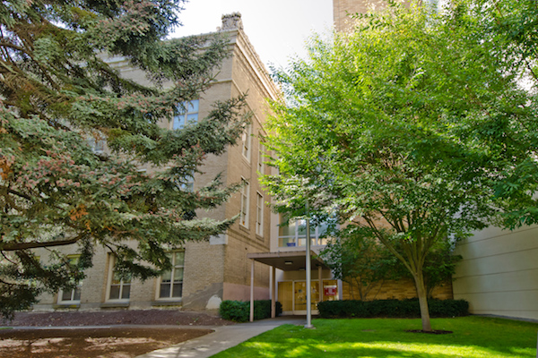 Neutral exterior of a university research building associated with ethical psilocybin research and voluntary data collection in Oregon
