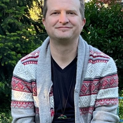 Portrait of Arlo, a psilocybin facilitator in Oregon with a background in art, mental health, and creative integration, offering safe psilocybin treatment and support for psilocybin experience in Oregon.